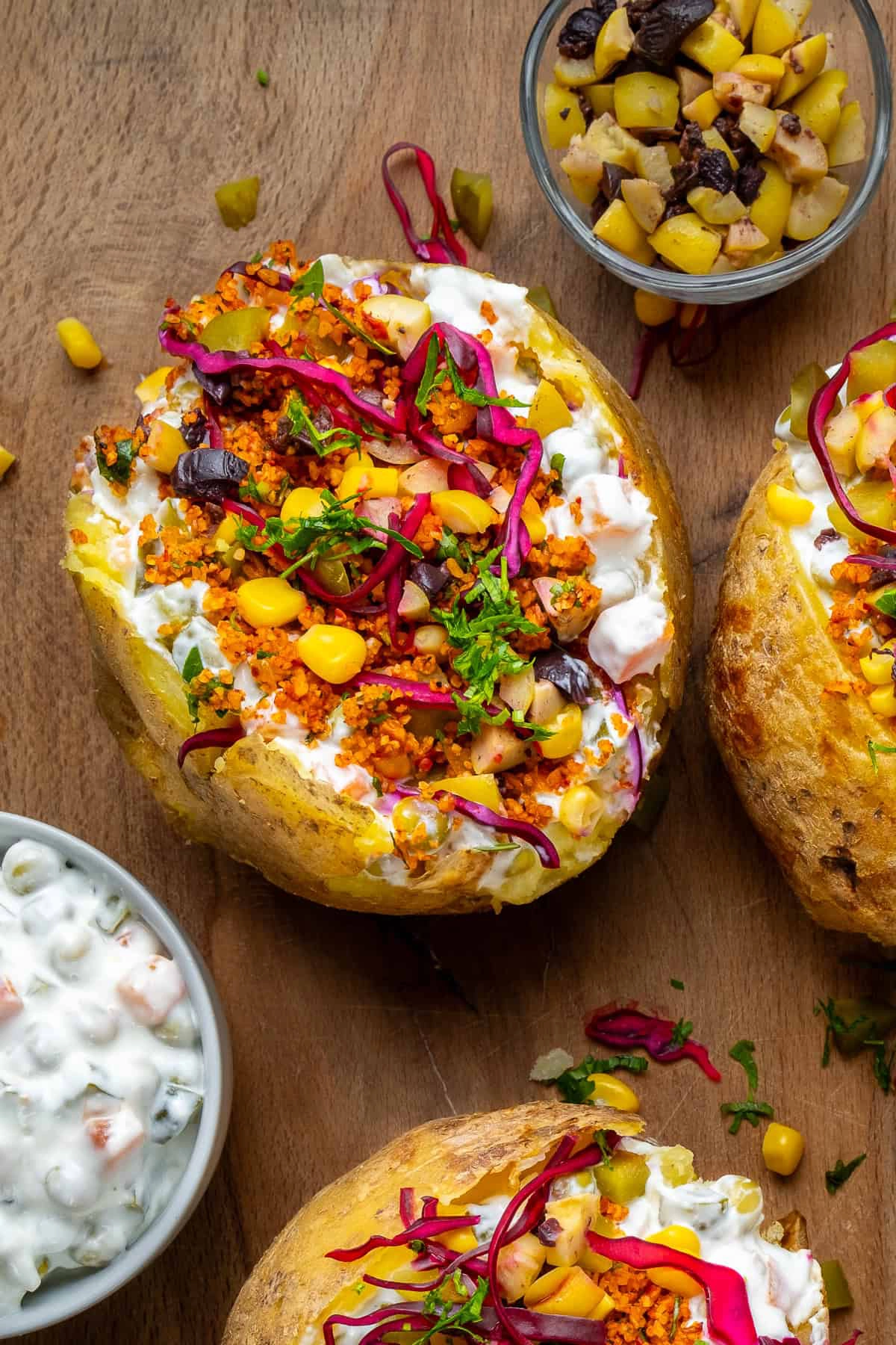 A freshly baked kumpir with colorful toppings